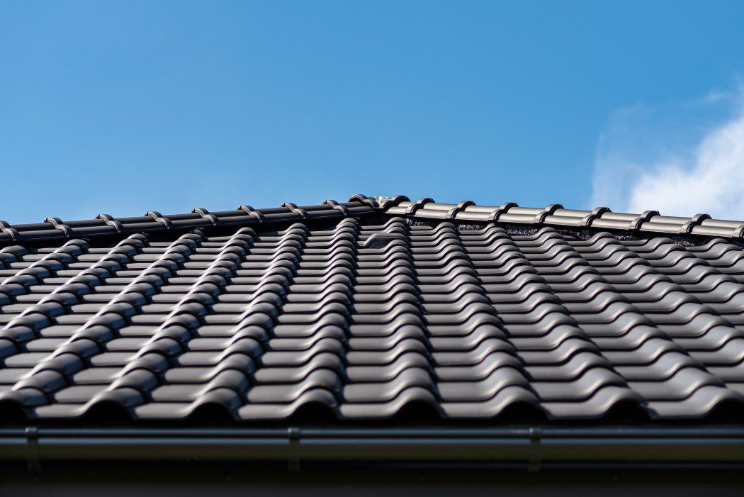 A freshly repaired roof with ceramic tiles