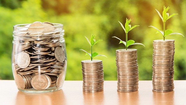 Jar and stack of coins 